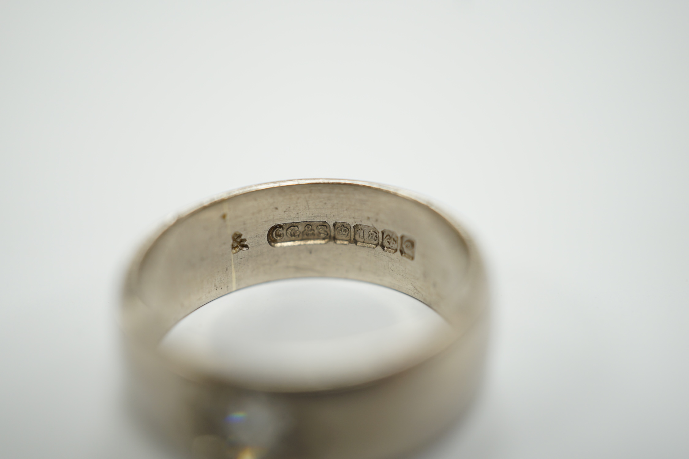 An 18ct white gold and gypsy set solitaire diamond ring, size G, gross weight 5.4 grams.